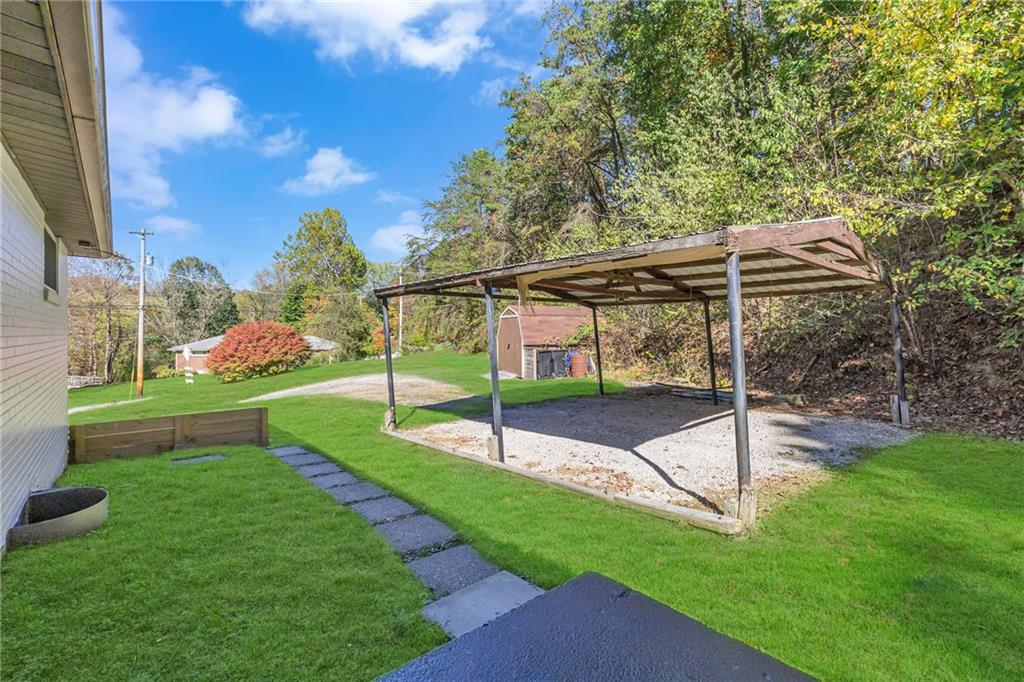 584 Chapel Road Aliquippa, PA 15001 - Photo 29 of 30 If you don't want to park in the garage and/or have a second vehicle, the carport has you covered!