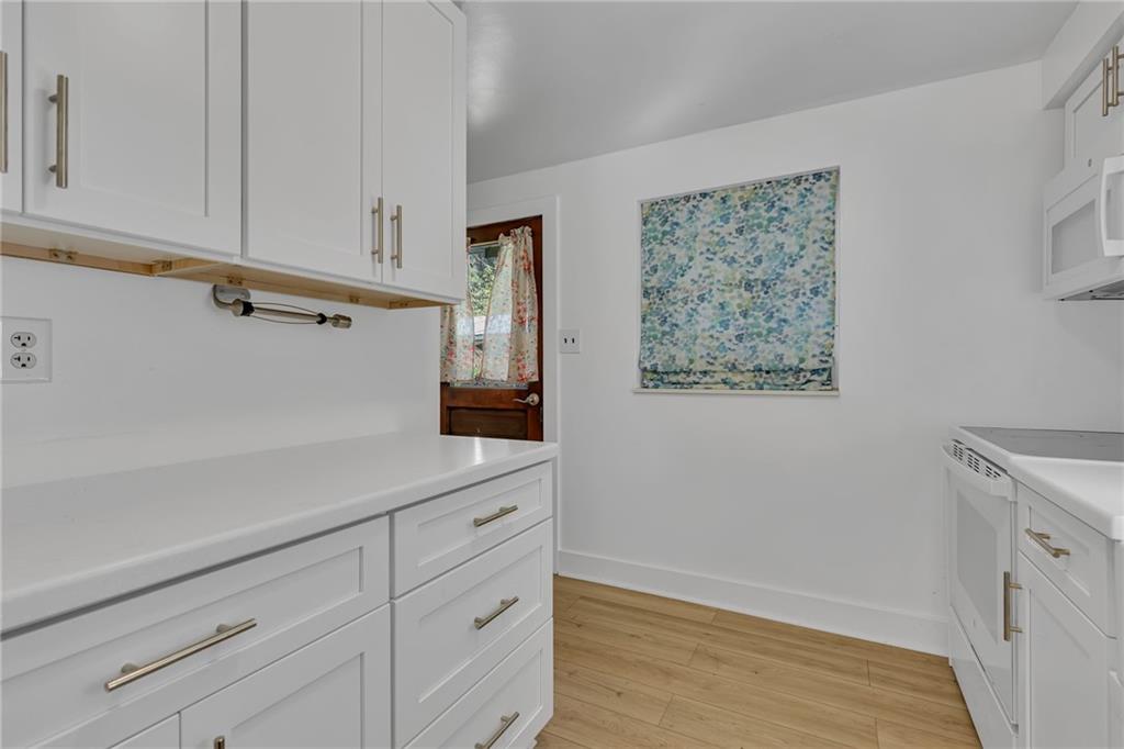 584 Chapel Road Aliquippa, PA 15001 - Photo 9 of 30 Direct access into the kitchen, this door leads to the sidewalk and carport. Basement steps are across from the back door.