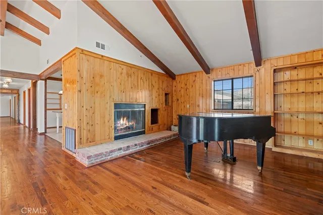 a view of living room with furniture and wooden floor