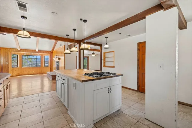 a view of an empty room with a window and closet