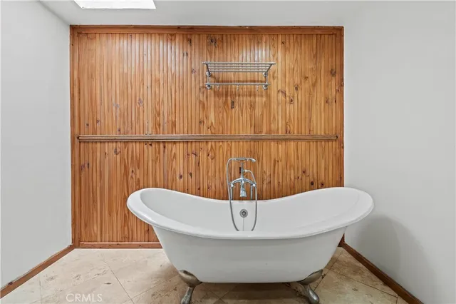 a view of a large white house with a snow on the road