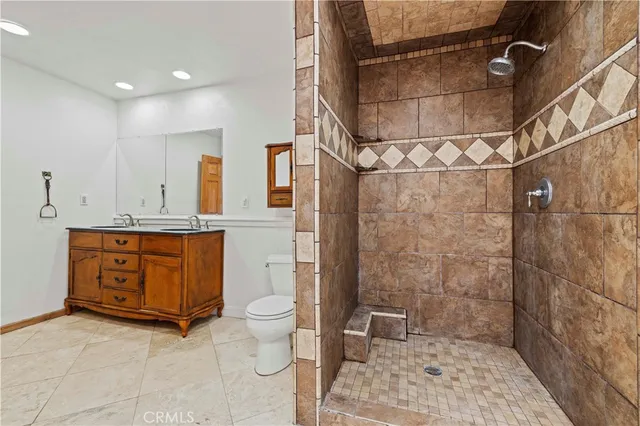 a view of a houses with snow on the road