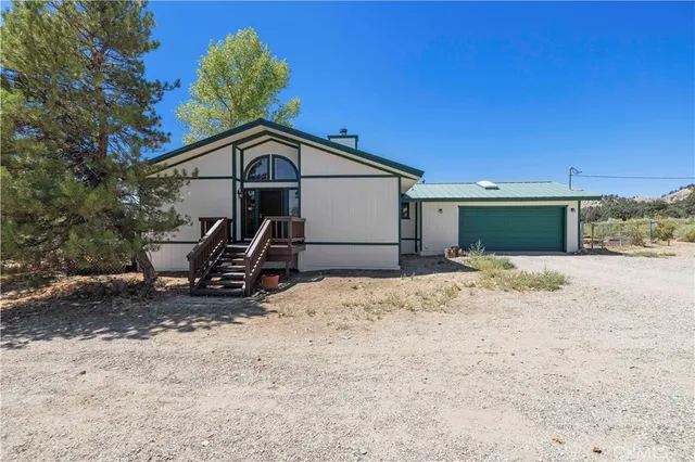 a big room with wooden floor and windows