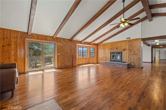 a view of a livingroom with furniture and wooden floor
