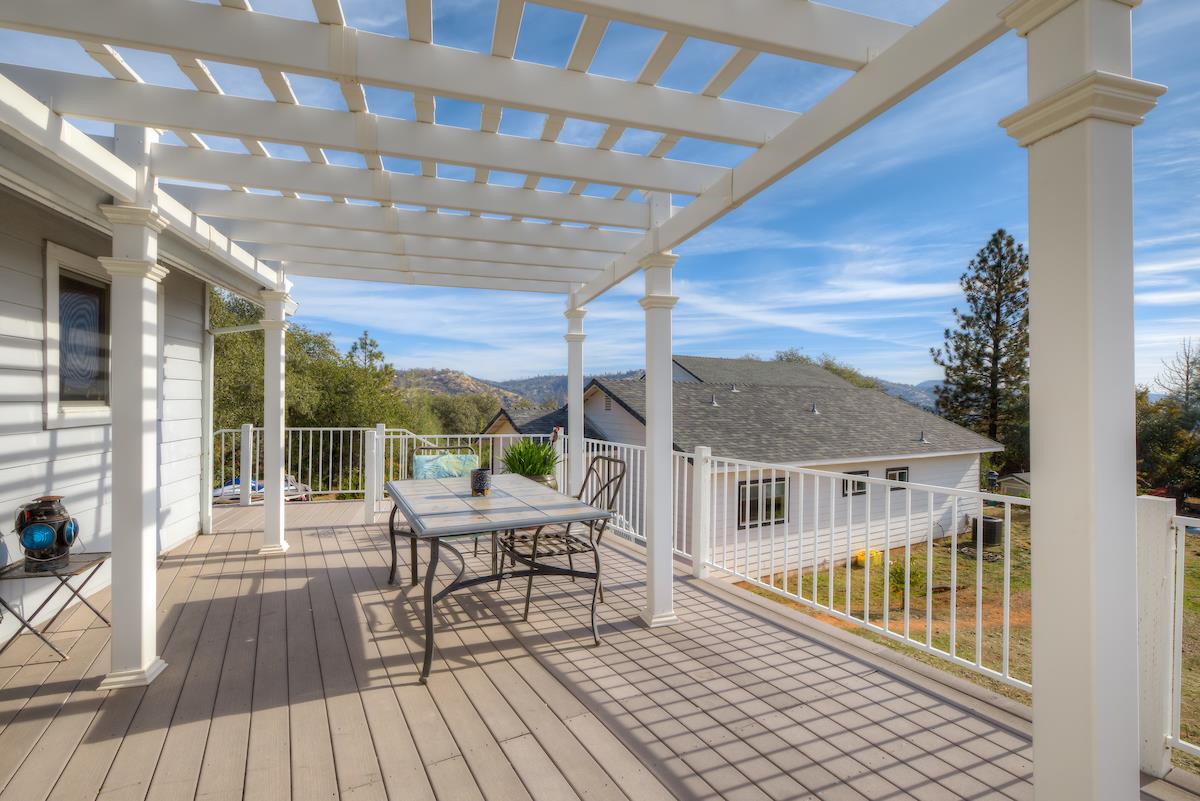83 Northfork Road Berry Creek, CA 95916 - Photo 22 of 56 a balcony with hardwood filled with furniture