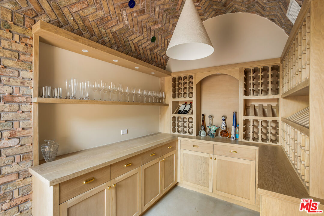 1744 Reedvale Lane Los Angeles, CA 90049 - Photo 13 of 30 a bathroom with a sink and a mirror