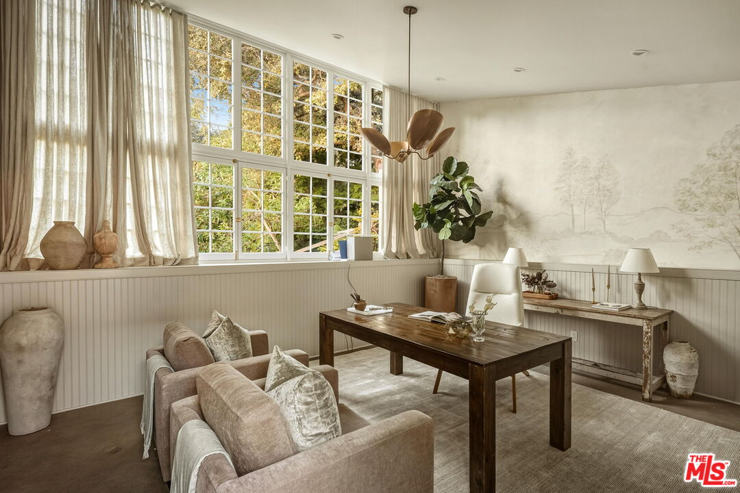 1744 Reedvale Lane Los Angeles, CA 90049 - Photo 26 of 30 a living room with furniture and a window