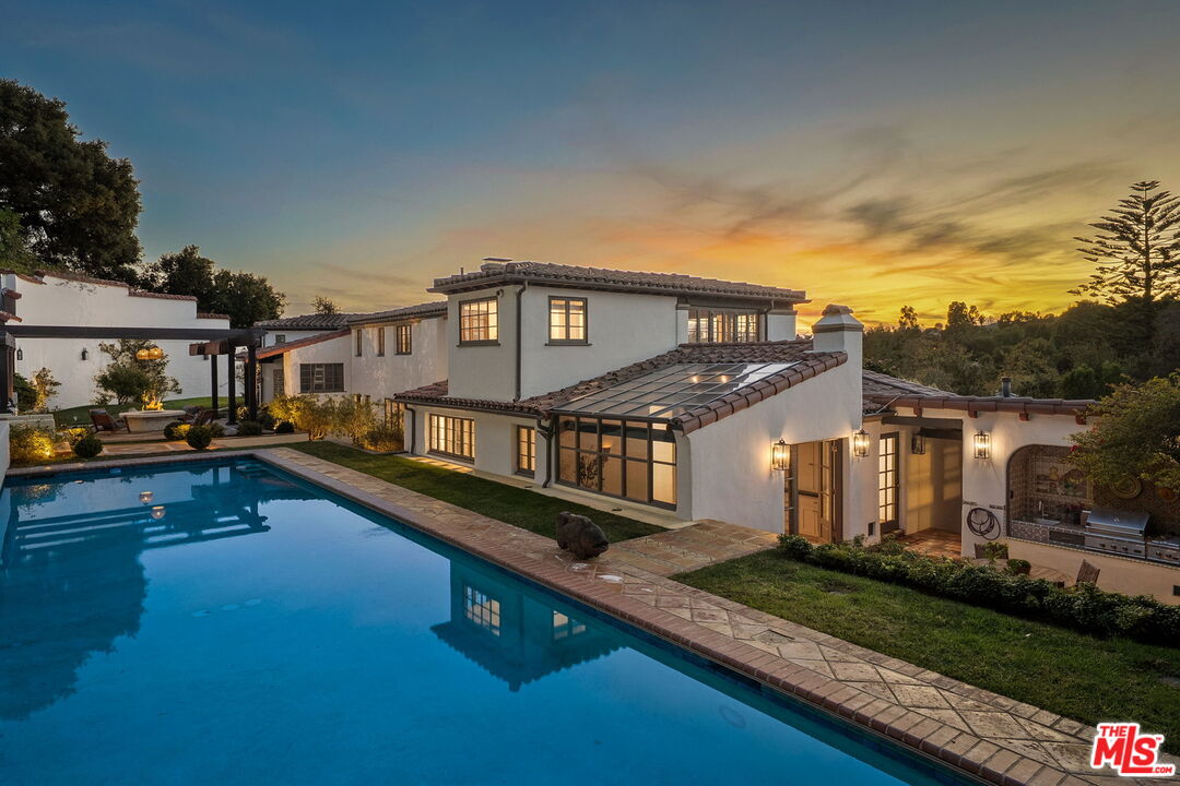 1744 Reedvale Lane Los Angeles, CA 90049 - Photo 27 of 30 a front view of a house with a yard