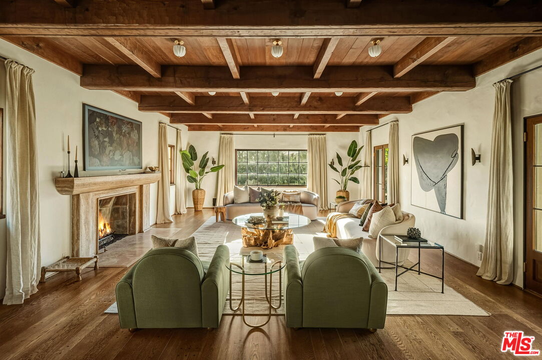 1744 Reedvale Lane Los Angeles, CA 90049 - Photo 4 of 30 a living room with furniture and a fireplace