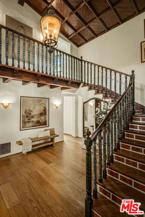 1744 Reedvale Lane Los Angeles, CA 90049 - Photo 6 of 30 a view of an empty room with wooden floor