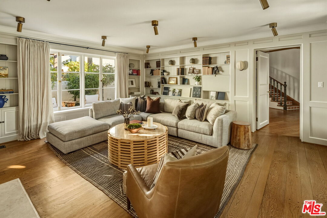 1744 Reedvale Lane Los Angeles, CA 90049 - Photo 7 of 30 a living room with furniture and wooden floor
