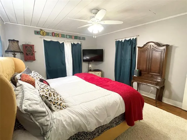 a bed room with a bed and a television