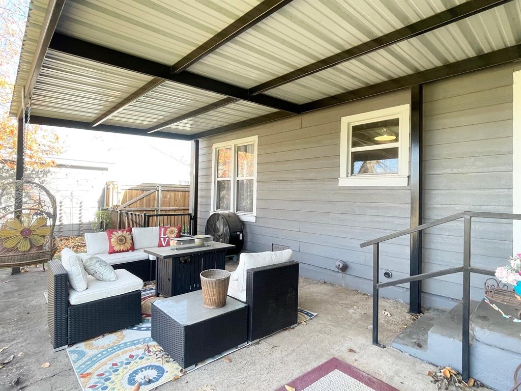 1208 Carolina Street Graham, TX 76450 - Photo 16 of 25 a outdoor space with patio the couches and a dining table with balcony view
