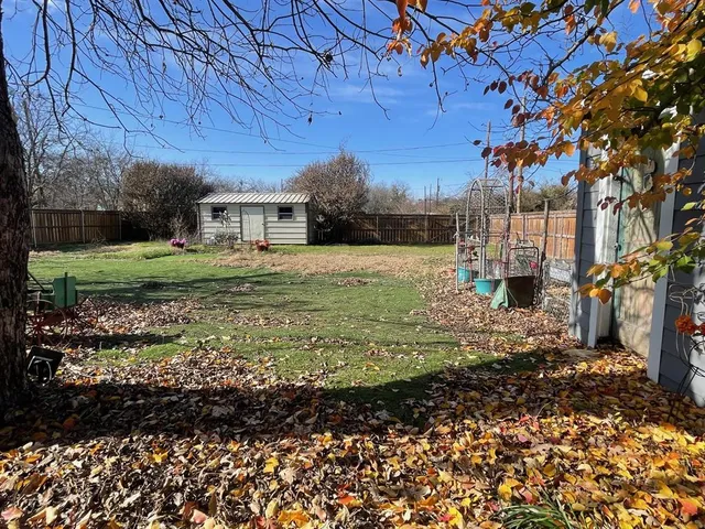 a backyard of a house with outdoor seating