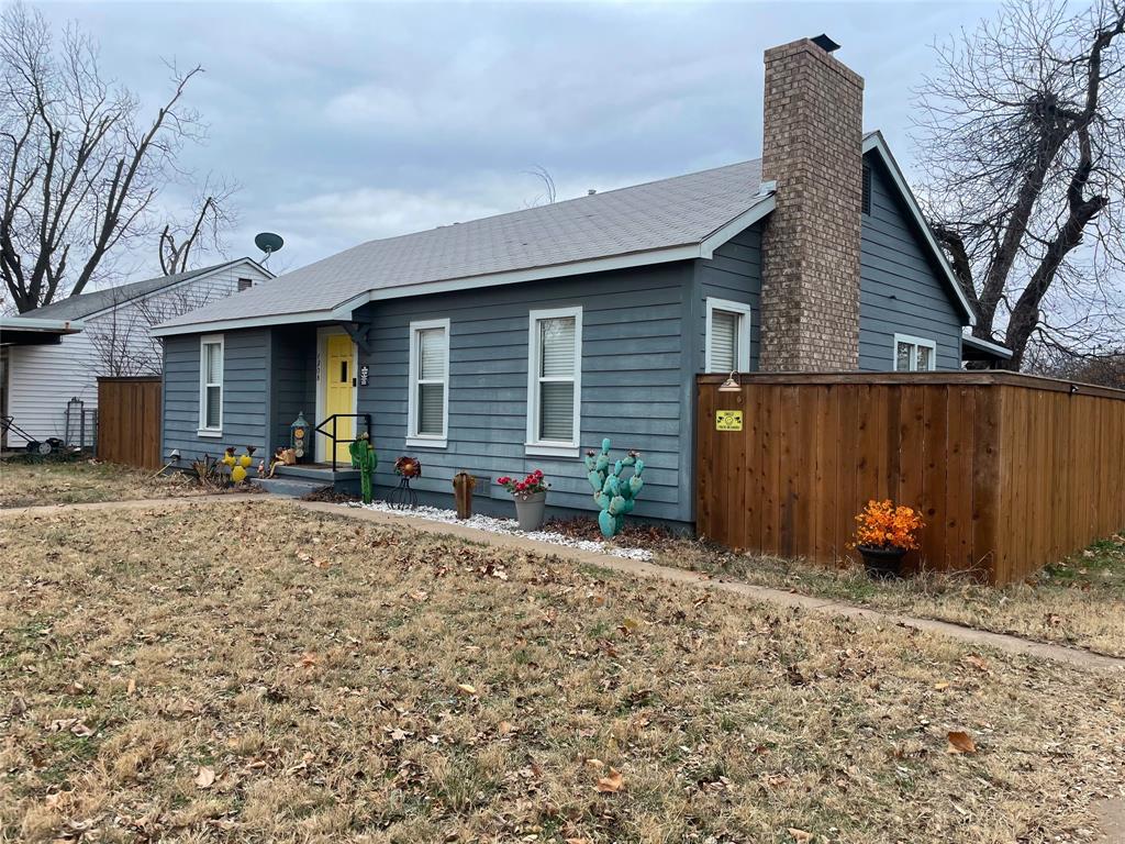 1208 Carolina Street Graham, TX 76450 - Photo 25 of 25 a view of a house with backyard and chairs