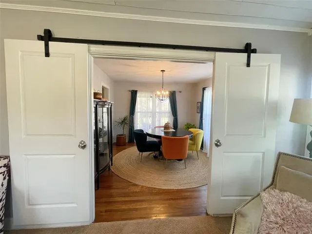 a view of a living room and bathroom with a tub
