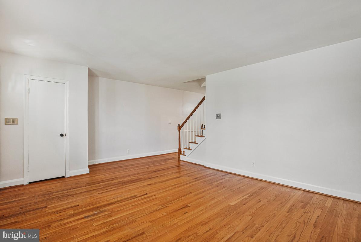 1016 Winsford Road Towson, MD 21204 - Photo 5 of 42 a view of an empty room with wooden floor