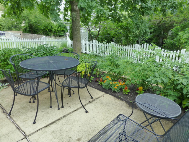 1726 Ranchview Drive Naperville, IL 60565 - Photo 2 of 14 a view of a chairs and table in backyard