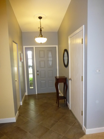 1726 Ranchview Drive Naperville, IL 60565 - Photo 4 of 14 a view of a hallway with wooden floor and a bathroom