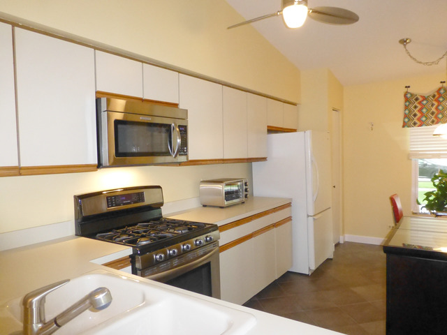 1726 Ranchview Drive Naperville, IL 60565 - Photo 7 of 14 a kitchen with a stove and a microwave