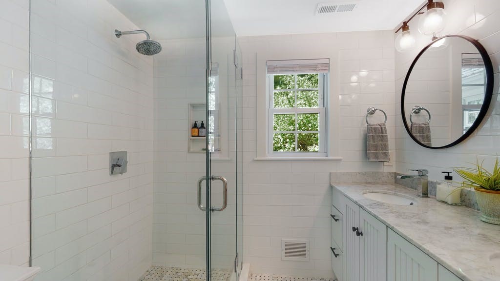 16 Chiltern Road Weston, MA 02493 - Photo 23 of 35 a bathroom with a granite countertop sink mirror and window