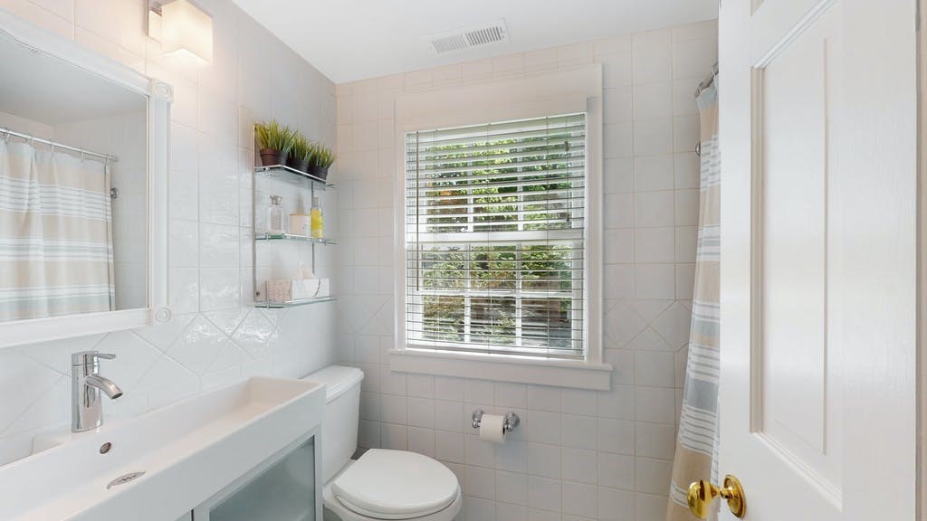 16 Chiltern Road Weston, MA 02493 - Photo 28 of 35 a bathroom with a sink a toilet and tub