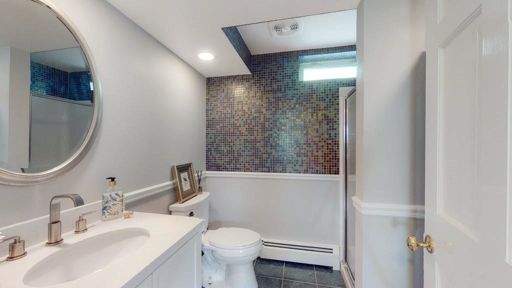 16 Chiltern Road Weston, MA 02493 - Photo 8 of 35 a bathroom with a sink toilet and vanity