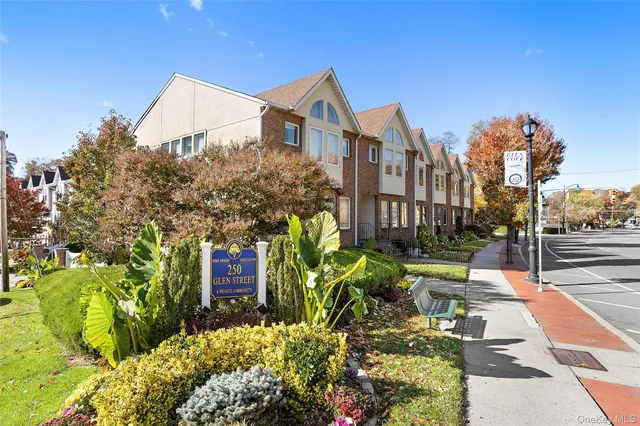 a view of a large building with a big yard and large trees