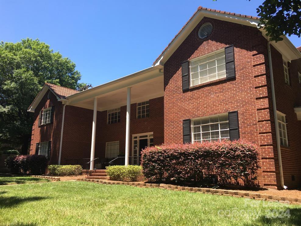 1708 Dilworth Road West, Unit 8 Charlotte, NC 28203 - Photo 1 of 15 front view of a house with a yard