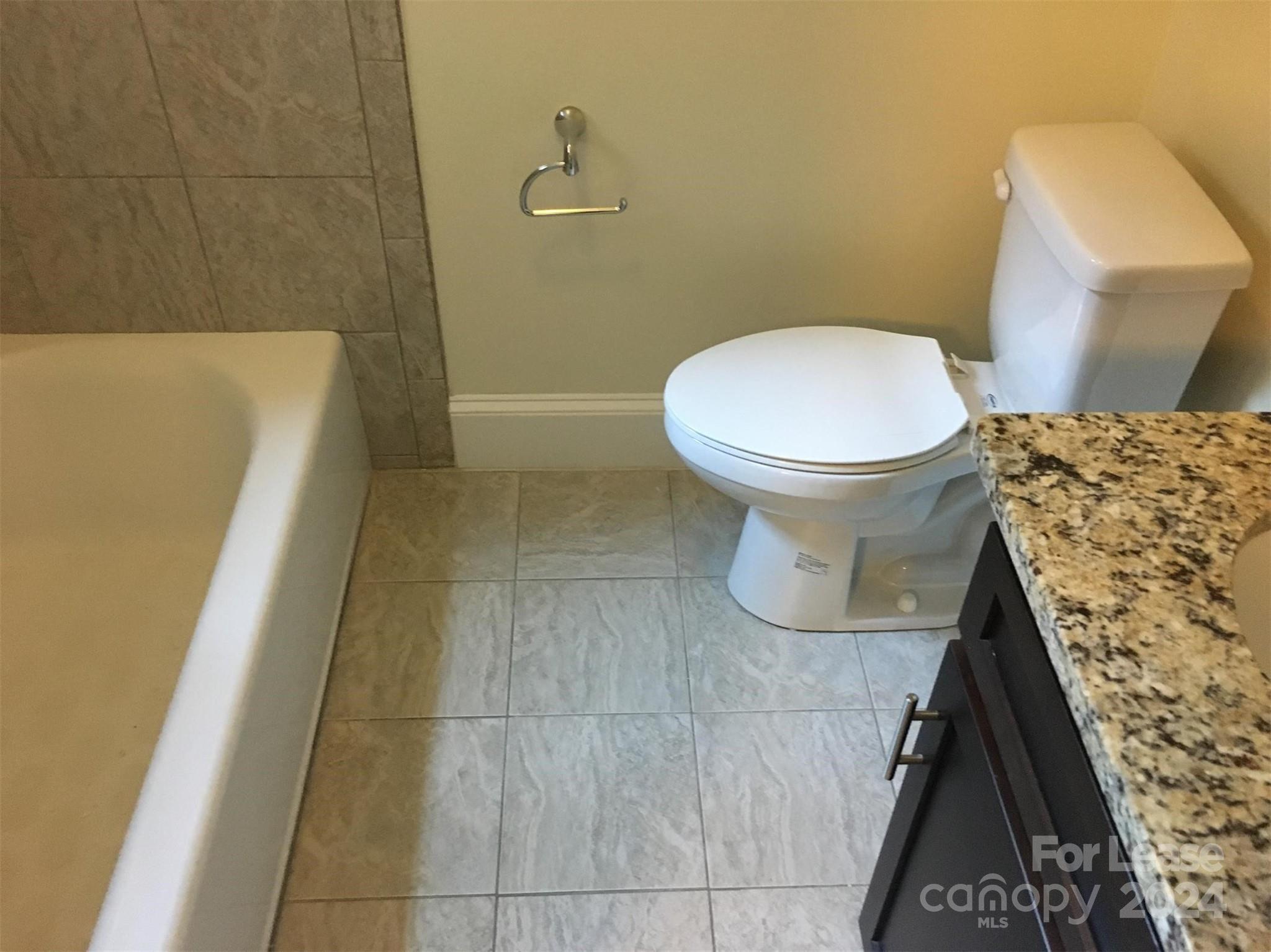 1708 Dilworth Road West, Unit 8 Charlotte, NC 28203 - Photo 14 of 15 a bathroom with a sink and a toilet