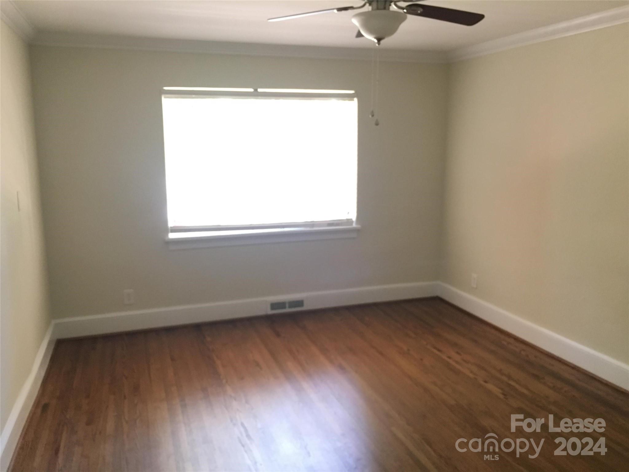 1708 Dilworth Road West, Unit 8 Charlotte, NC 28203 - Photo 10 of 15 an empty room with a window