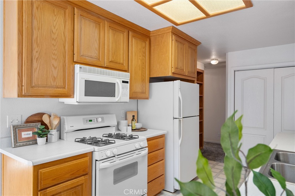 5245 Headwaters Road Forest Ranch, CA 95942 - Photo 18 of 47 a kitchen with a white stove top oven and refrigerator