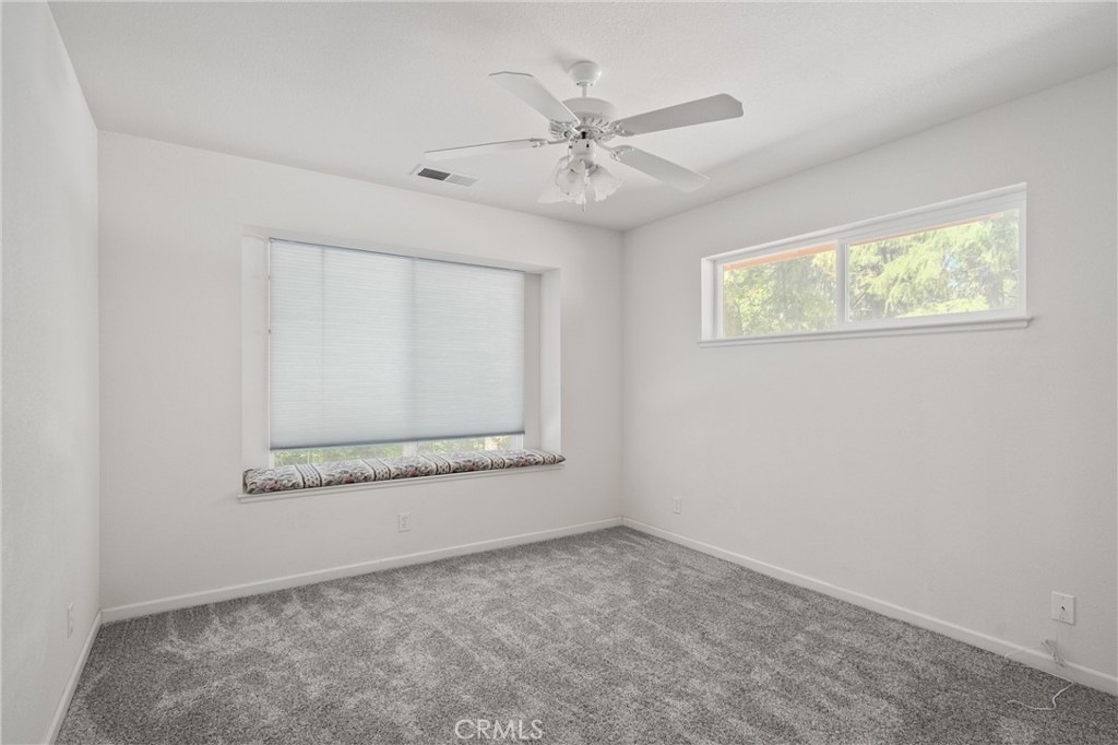 5245 Headwaters Road Forest Ranch, CA 95942 - Photo 20 of 47 an empty room with a window and a ceiling fan
