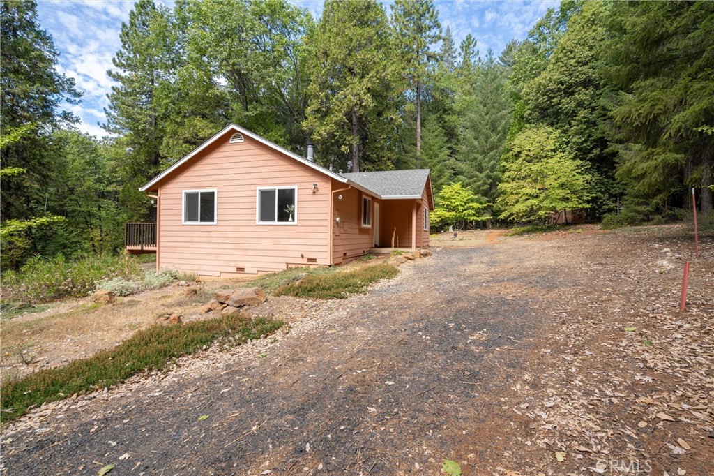 5245 Headwaters Road Forest Ranch, CA 95942 - Photo 25 of 47 a view of a house with a yard and large trees