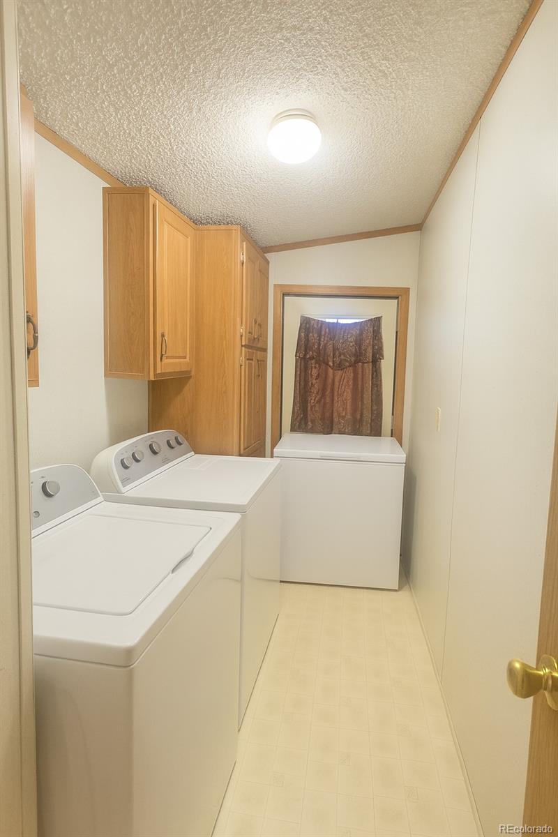 601 North Lane Avondale, CO 81022 - Photo 3 of 4 a bathroom with a sink a mirror and a bathtub