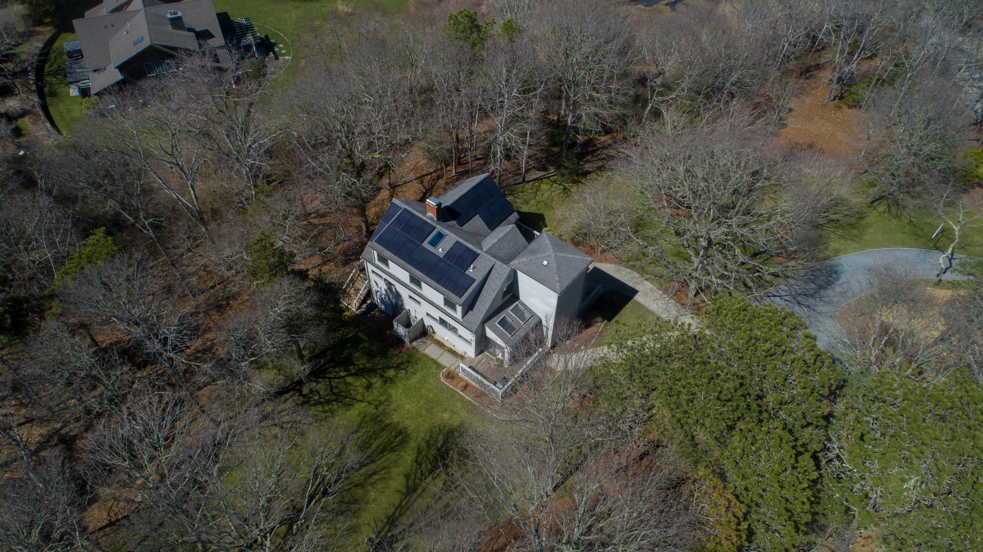 237 Lagoon Pond Road Vineyard Haven, MA 02568 - Photo 19 of 21 an aerial view of a house with a yard