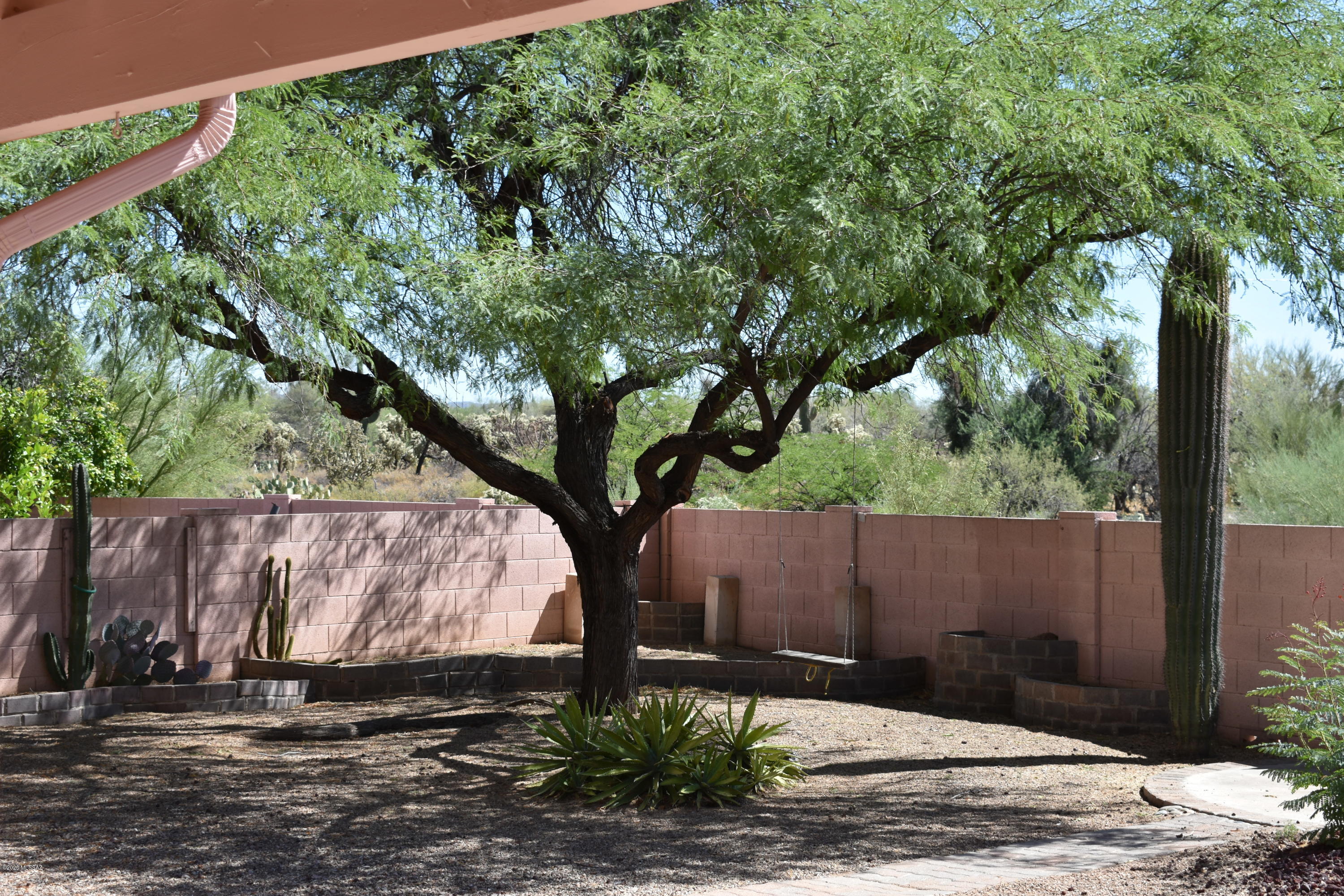 3504 West Sky Ridge Loop Tucson, AZ 85742 - Photo 10 of 13 a backyard of a house with lots of green space