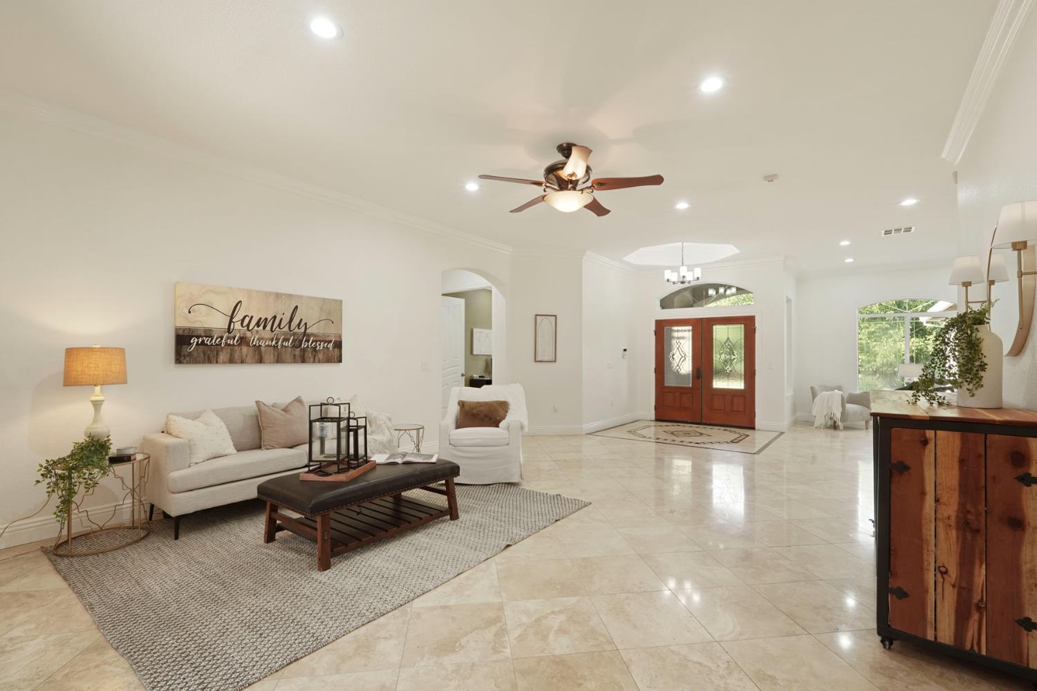 7306 Van Allen Road Stockton, CA 95215 - Photo 16 of 87 a living room with furniture and a chandelier