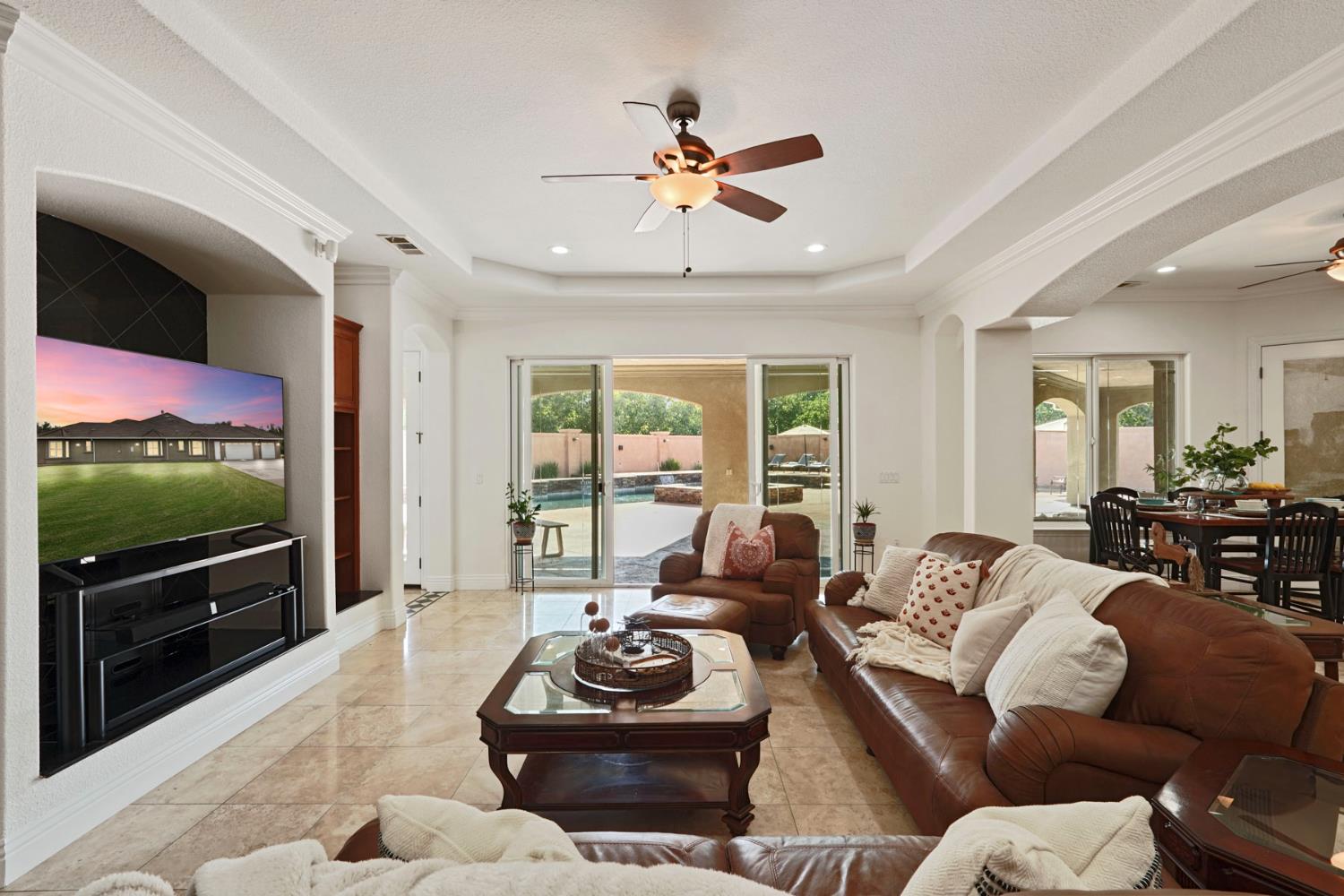7306 Van Allen Road Stockton, CA 95215 - Photo 24 of 87 a living room with furniture a flat screen tv and a chandelier