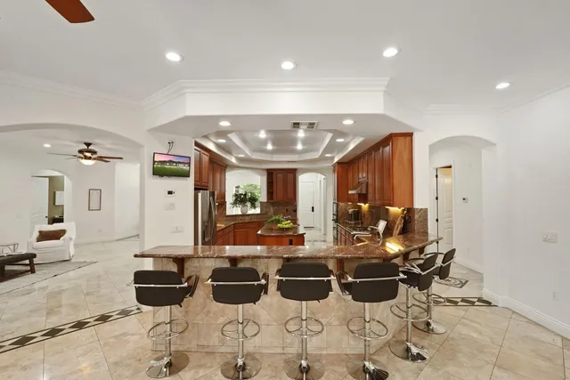 a spacious bathroom with a sink a mirror and a shower