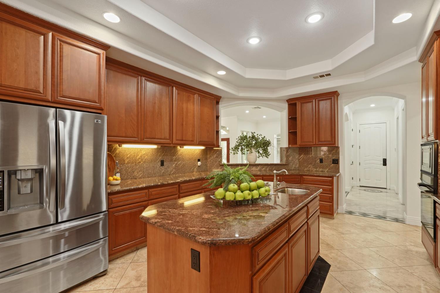 7306 Van Allen Road Stockton, CA 95215 - Photo 30 of 87 a kitchen with stainless steel appliances granite countertop a refrigerator and a stove