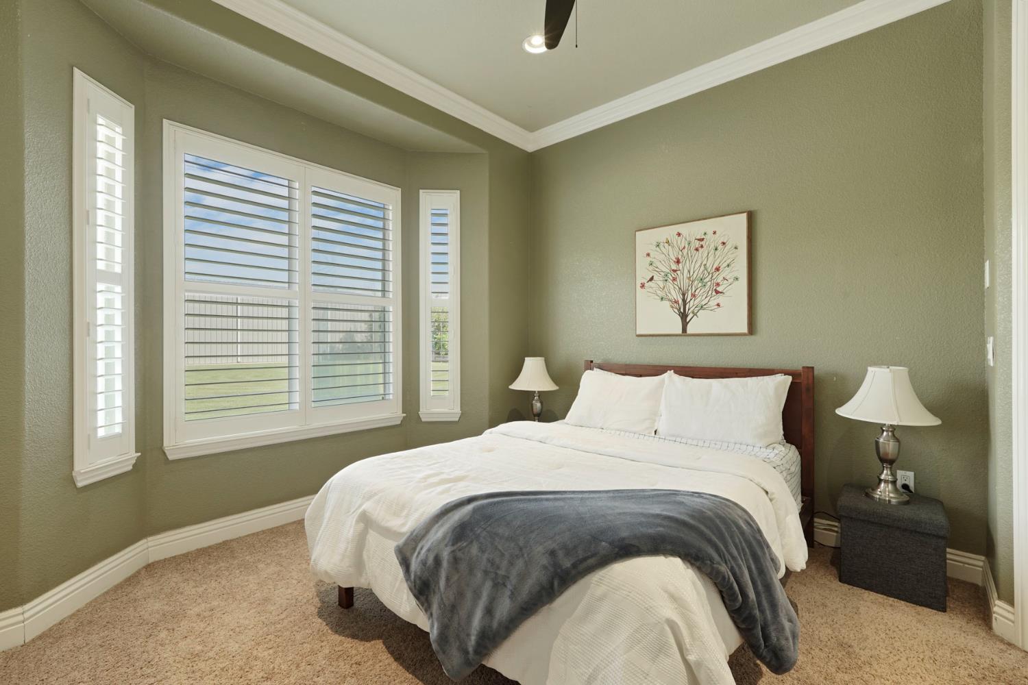 7306 Van Allen Road Stockton, CA 95215 - Photo 46 of 87 a bedroom with a bed and a painting on the wall