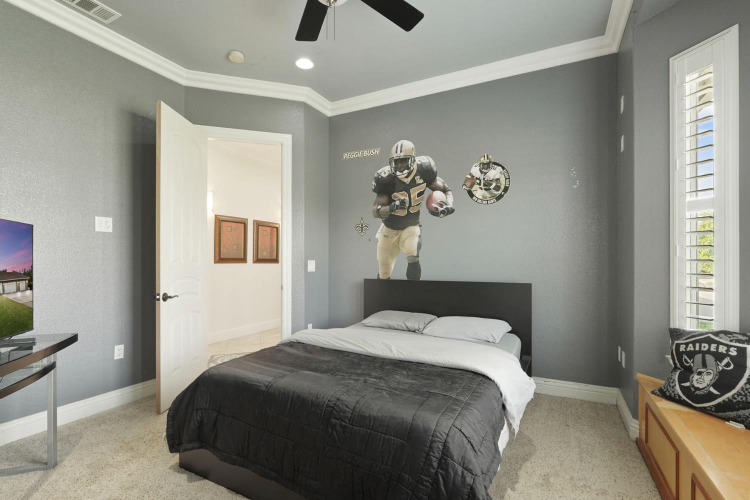 7306 Van Allen Road Stockton, CA 95215 - Photo 50 of 87 a bedroom with a bed and a chandelier