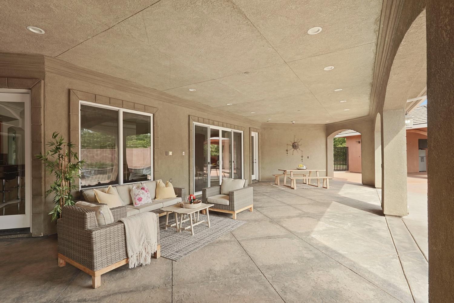 7306 Van Allen Road Stockton, CA 95215 - Photo 57 of 87 a living room with furniture and large windows