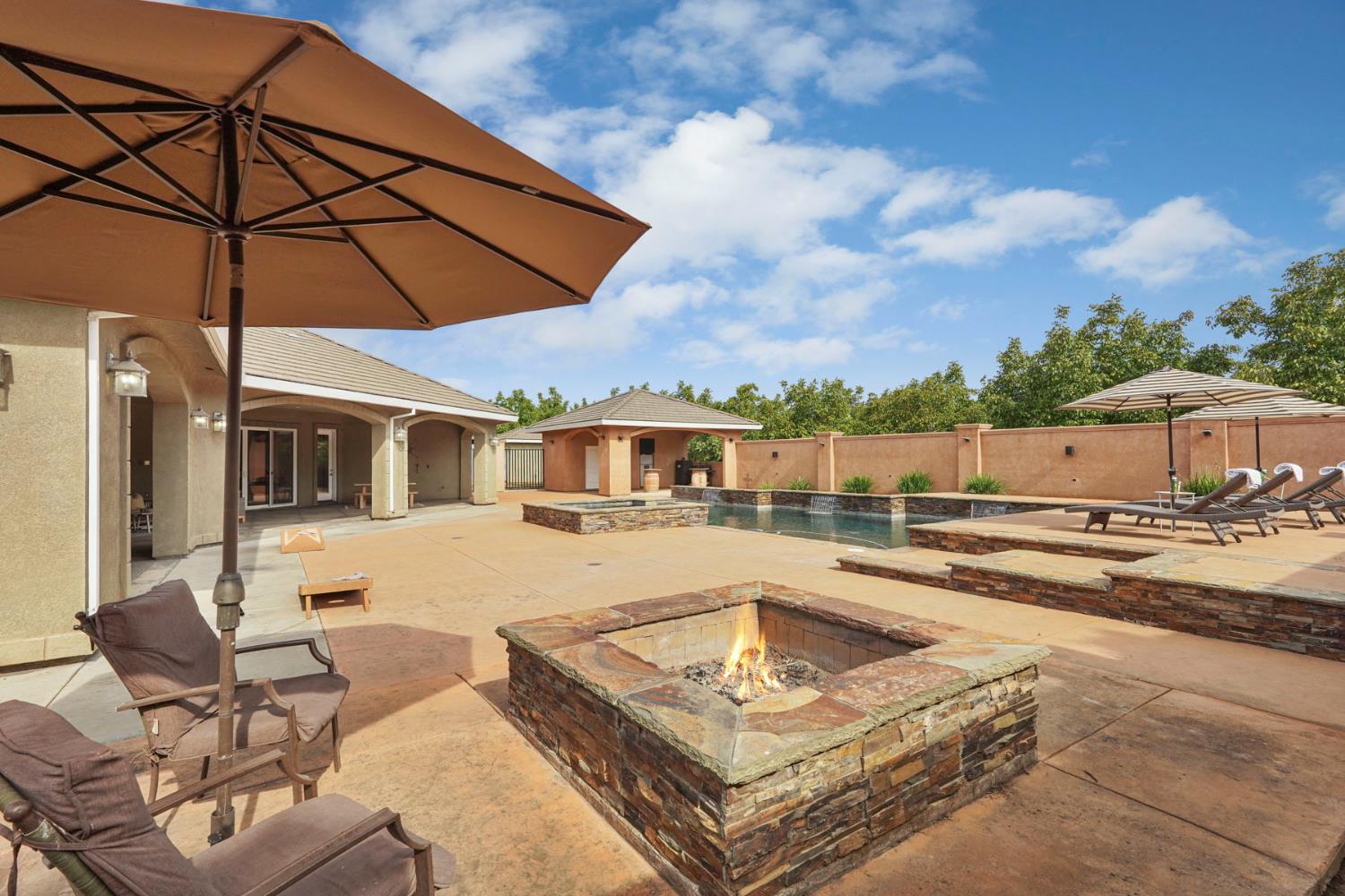 7306 Van Allen Road Stockton, CA 95215 - Photo 58 of 87 a view of a patio with swimming pool table and chairs