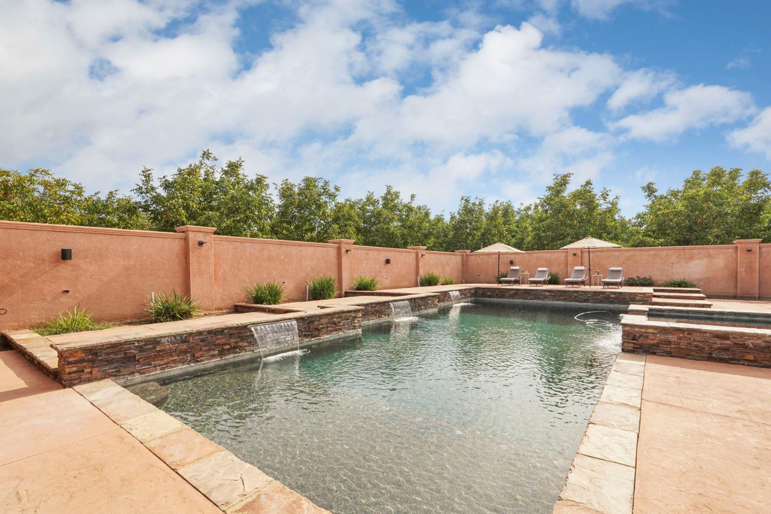 7306 Van Allen Road Stockton, CA 95215 - Photo 65 of 87 an aerial view of house with swimming pool and mountains in the background