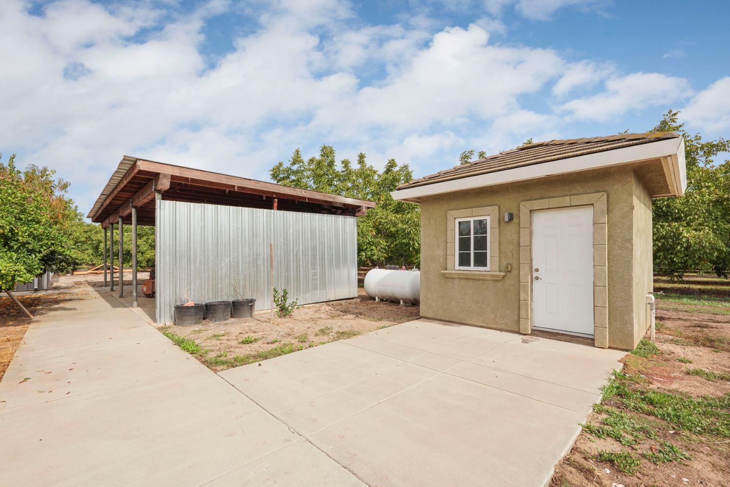 7306 Van Allen Road Stockton, CA 95215 - Photo 82 of 87 a backyard of a house with table and chairs and wooden fence