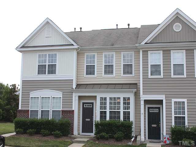 7813 Silverthread Lane Raleigh, NC 27617 - Photo 1 of 25 a front view of a house with plants and a yard