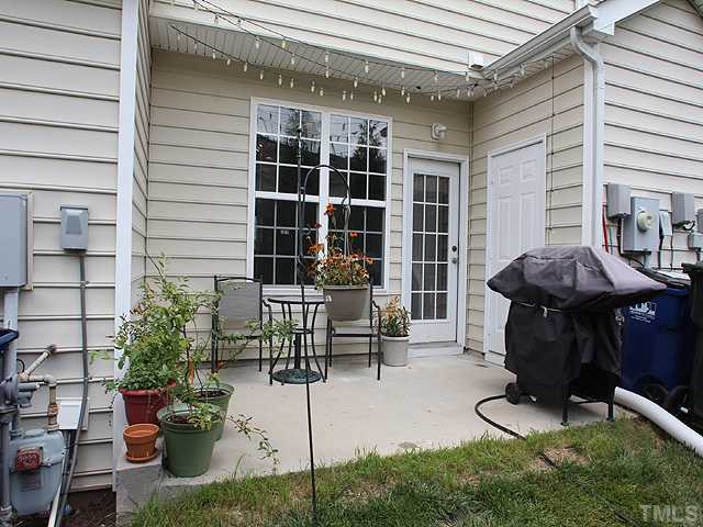 7813 Silverthread Lane Raleigh, NC 27617 - Photo 10 of 25 a front view of a house with outdoor seating