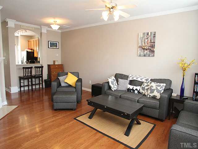 7813 Silverthread Lane Raleigh, NC 27617 - Photo 25 of 25 a living room with furniture and a wooden floor